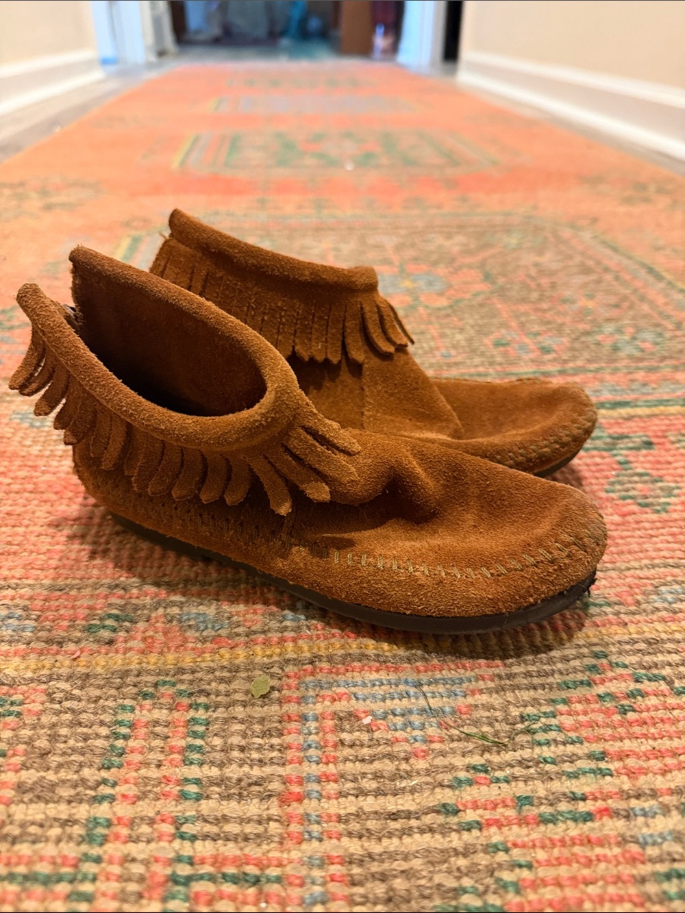 Minnetonka Kids Suede Fringe Moccasins in Warm Brown